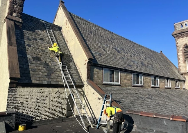 Roofing works with a ladder